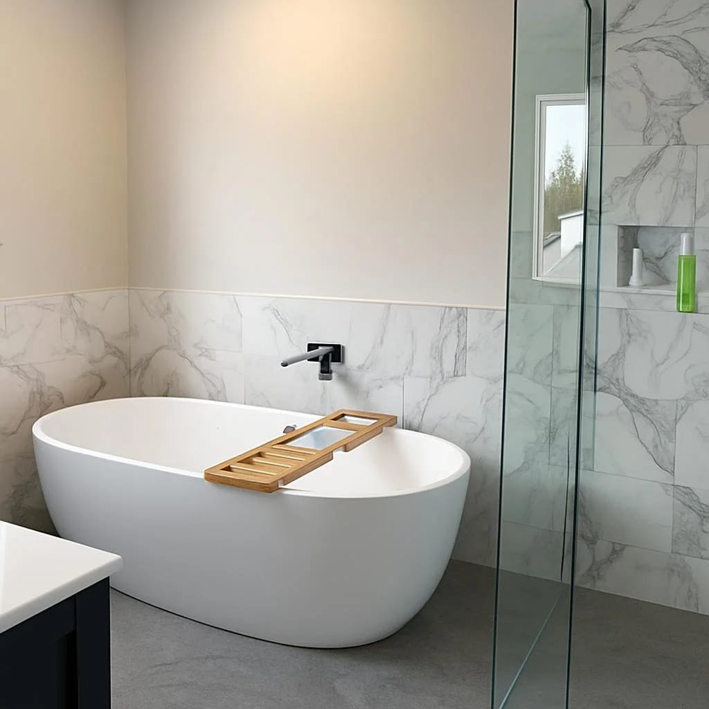 Clean white bathroom renovation featuring a freestanding soaker tub
